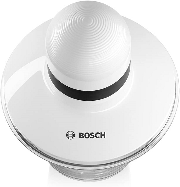 Vista superior de una picadora Bosch blanca con cuenco de cristal transparente y empujador estriado.