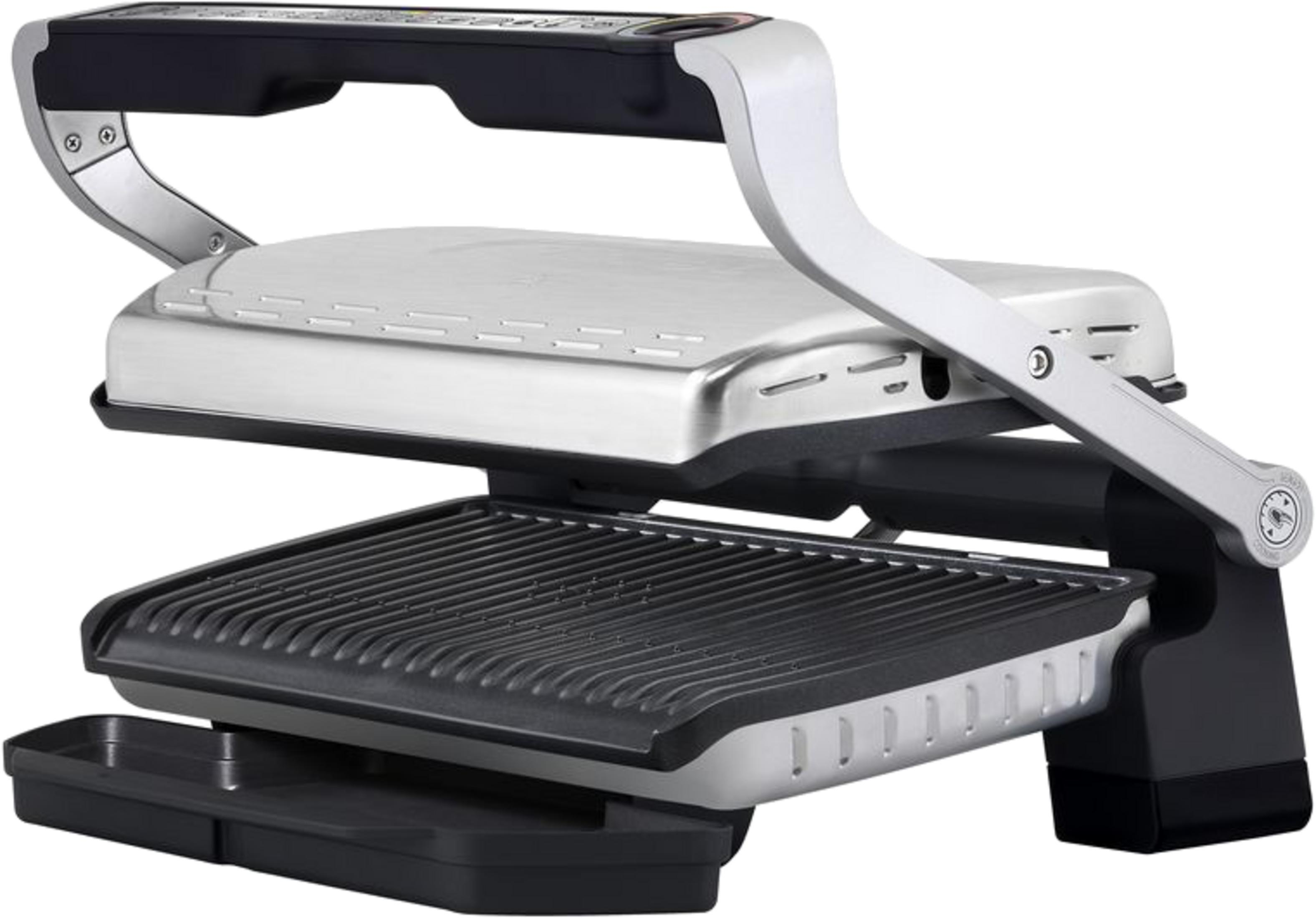 Ein silberner Tischgrill mit schwarzem Griff und gerippter Grillfläche vor weißem Hintergrund.