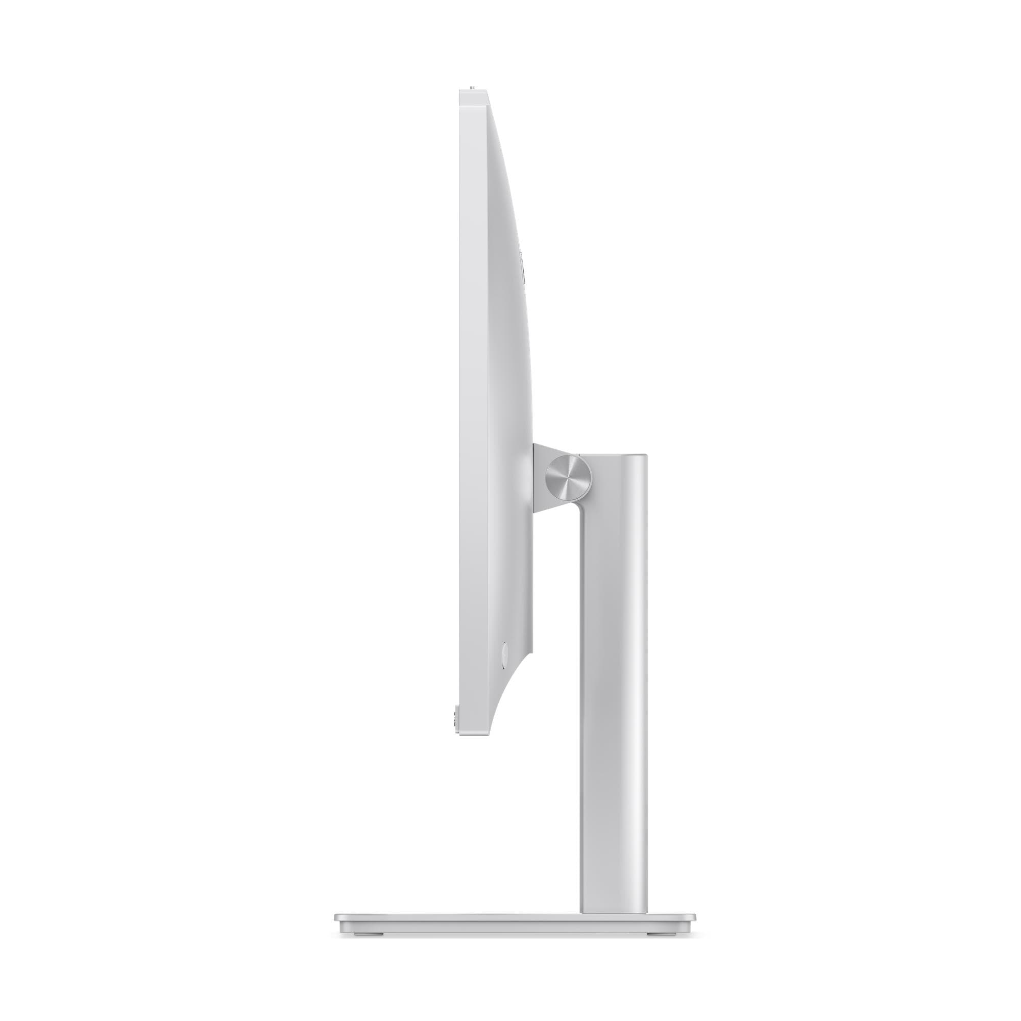 Vista laterale di un monitor per computer argentato su supporto coordinato, sfondo bianco.