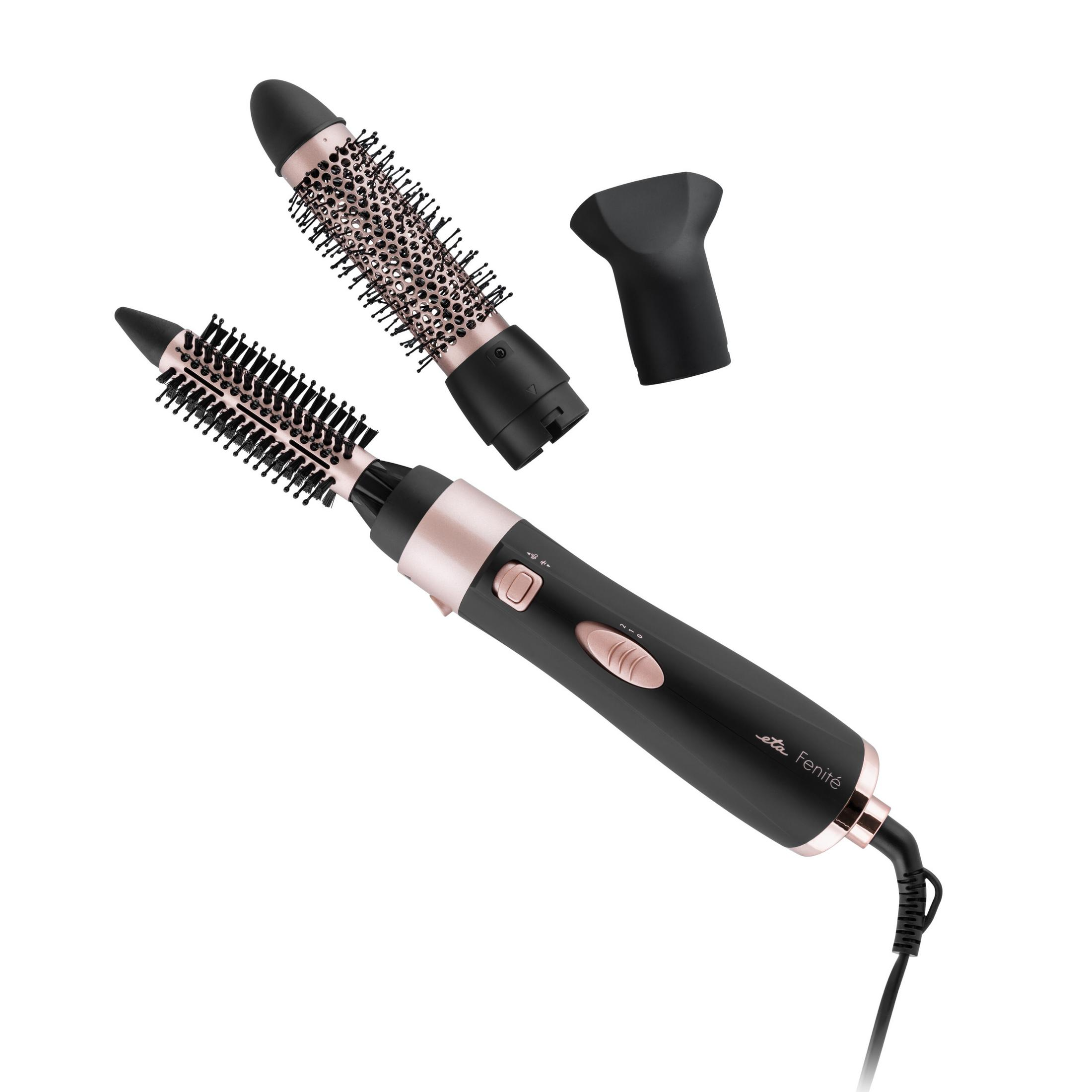 Un styler ad aria calda nero e oro rosa con accessori per spazzola rotonda intercambiabili.