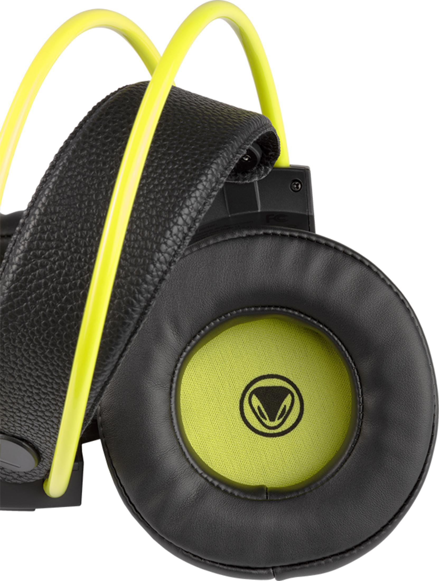 Close-up of black and neon green headphones with a textured headband and a round earcup featuring a logo.