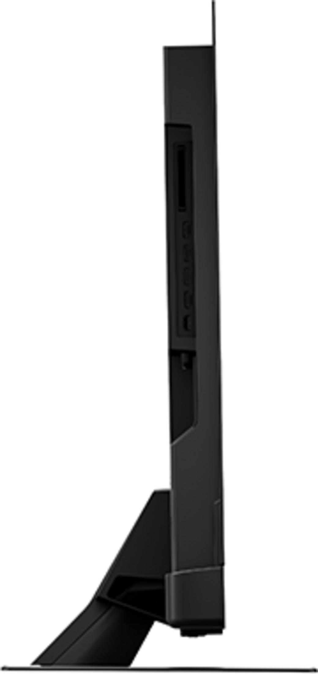 Vista laterale di un televisore nero sottile con porte sul retro e un supporto robusto.