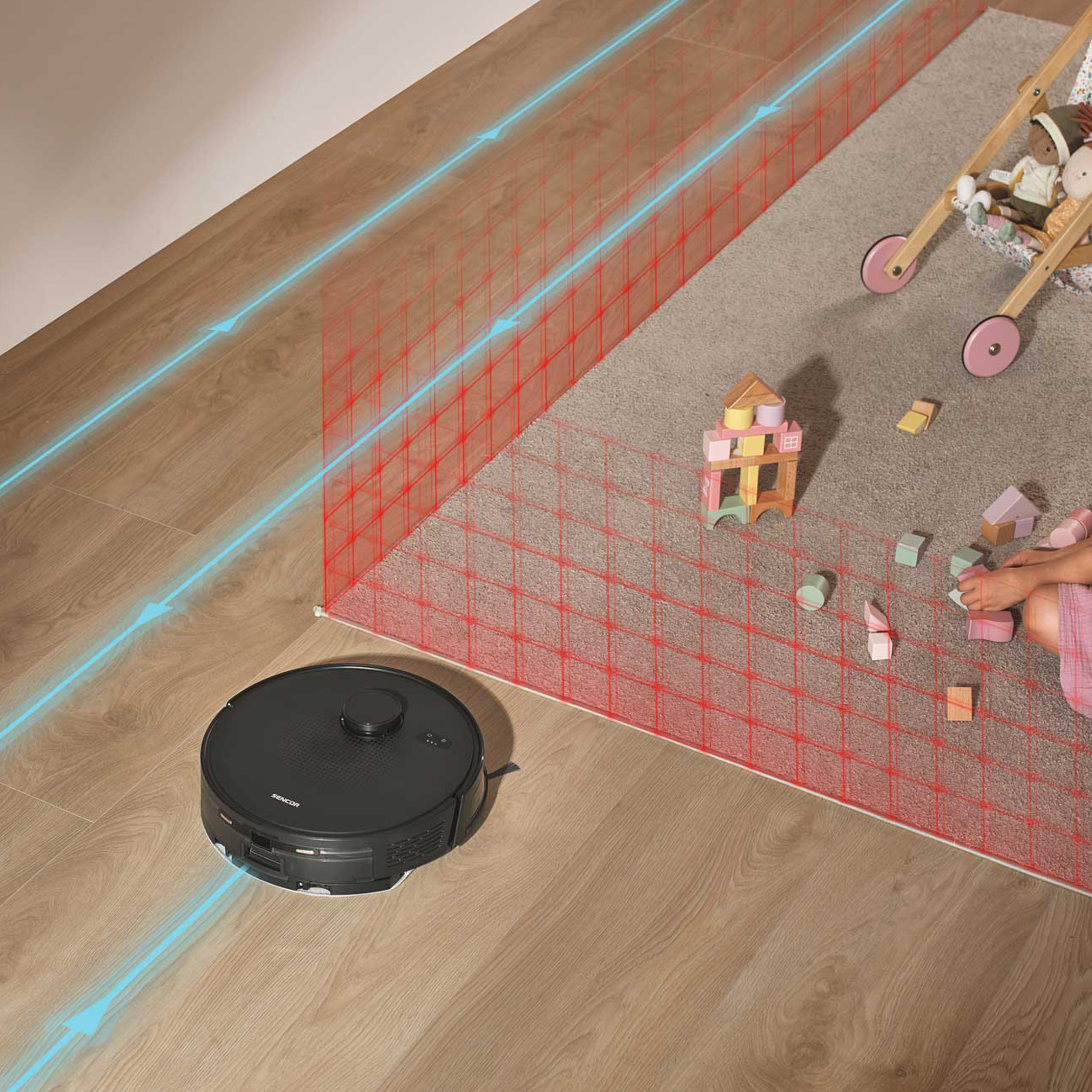 Un robot aspirador negro en suelo de madera evita una zona restringida marcada en rojo con juguetes.
