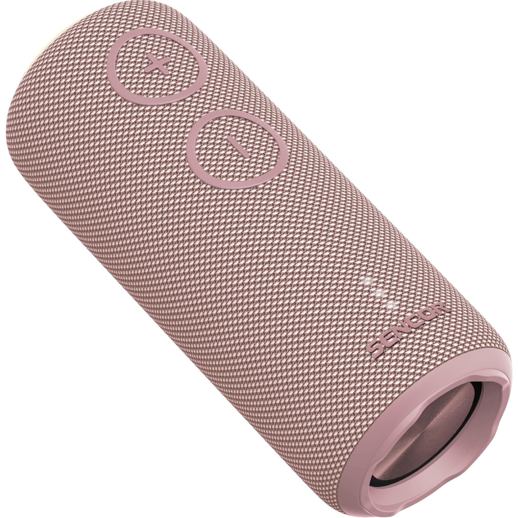 Cylindryczny, brudnoróżowy głośnik Bluetooth z materiałową siatką i przyciskami.