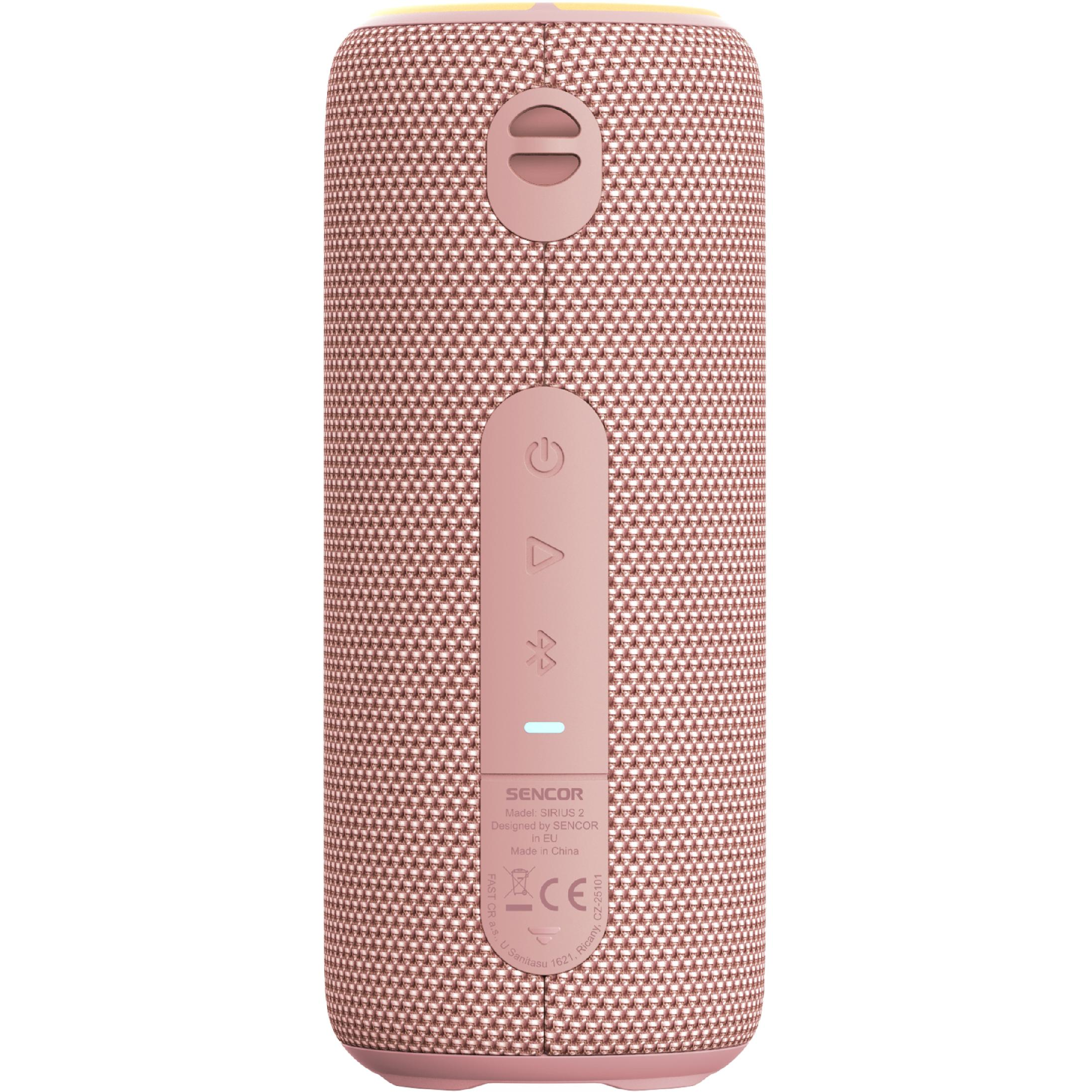 Różowy, cylindryczny głośnik Bluetooth z siatkową tkaniną, przyciskami sterującymi i tekstem z przodu.