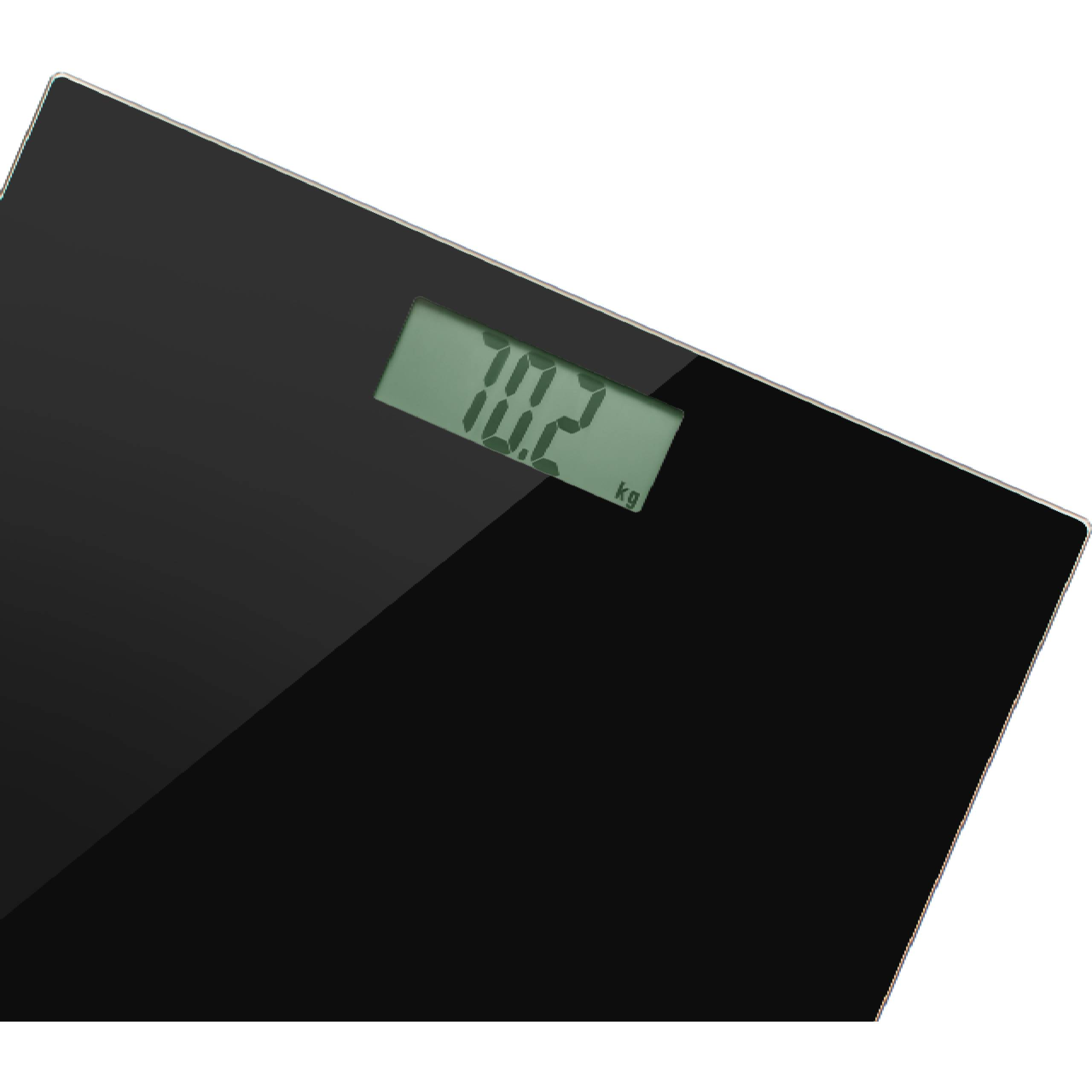 Una bilancia digitale nera mostra un display verde con 70,2 kg.