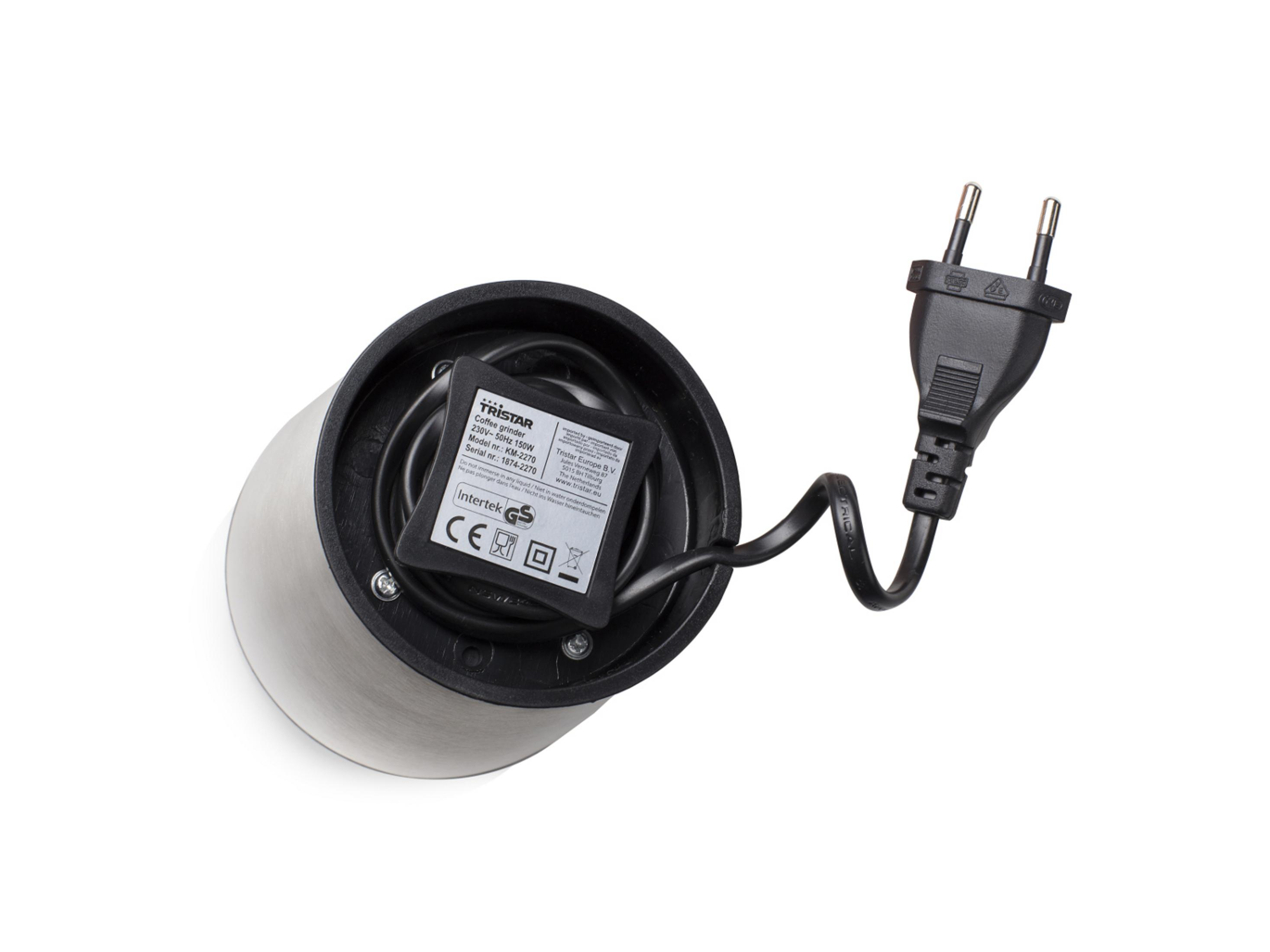 Die Unterseite eines Tristar Kaffeemahlwerks mit einem schwarzen Netzkabel und Stecker auf weißem Hintergrund.