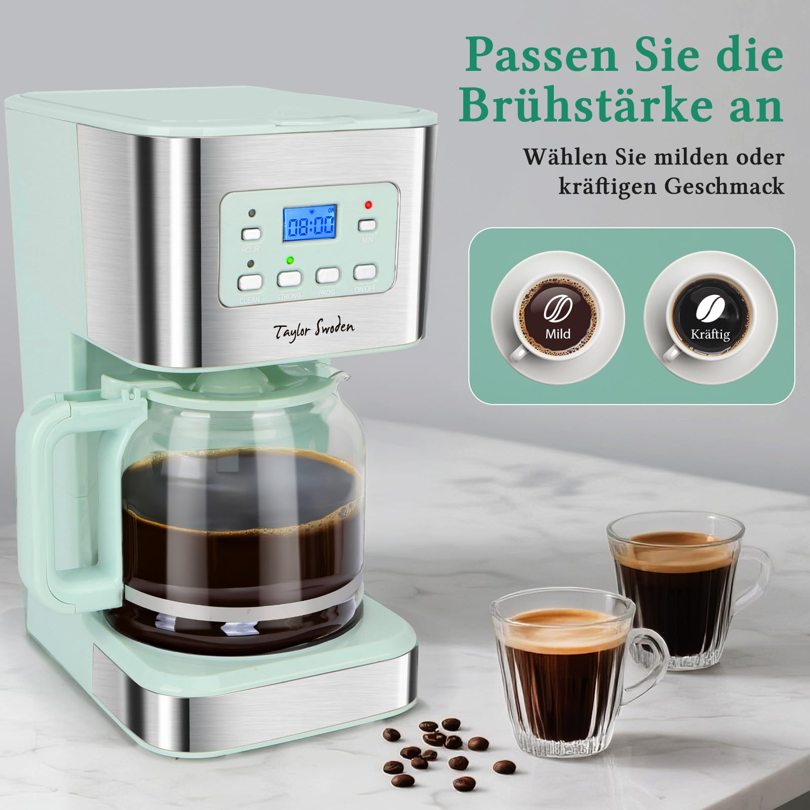 Caffettiera Taylor Swoden verde menta con caraffa di vetro e due tazze di caffè su marmo bianco.