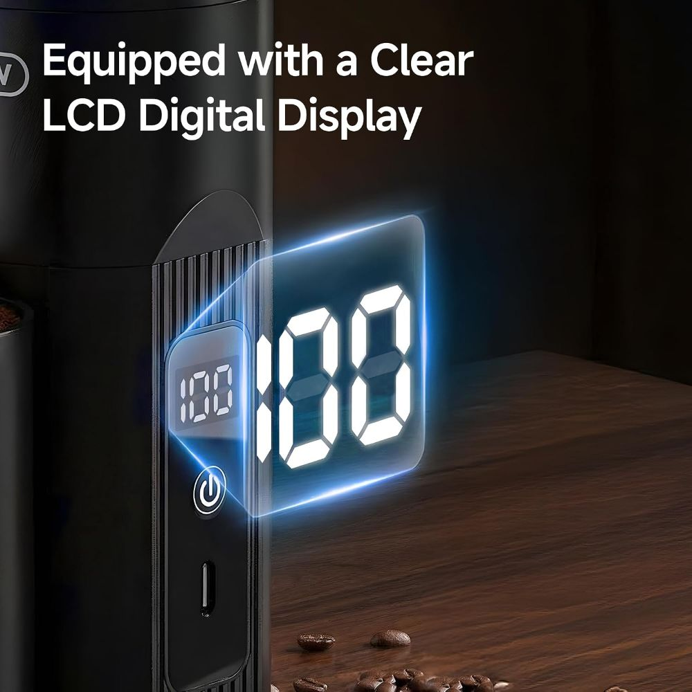 Dispositivo negro con pantalla digital LCD clara que muestra 100, sobre mesa de madera con granos de café.