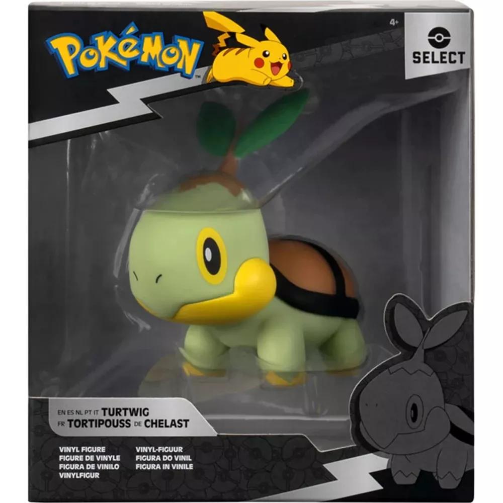 Una figura de vinilo de Pokémon Turtwig dentro de su caja de coleccionista negra y blanca.