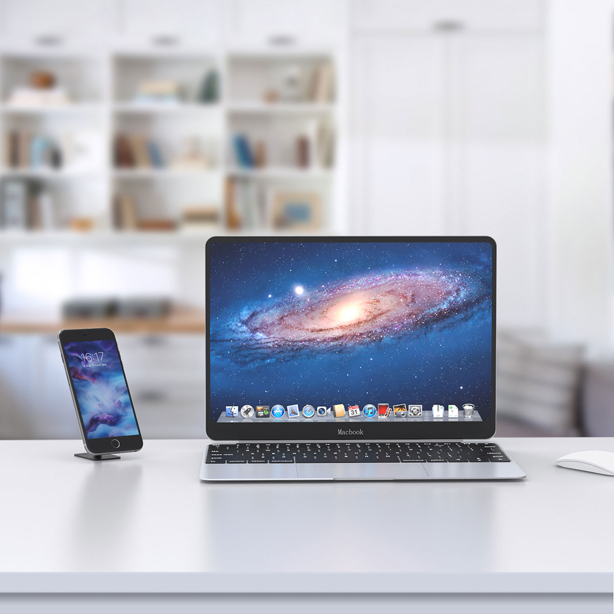 Bir odada beyaz bir masanın üzerinde galaksi duvar kağıdına sahip bir MacBook ve bir akıllı telefon duruyor.