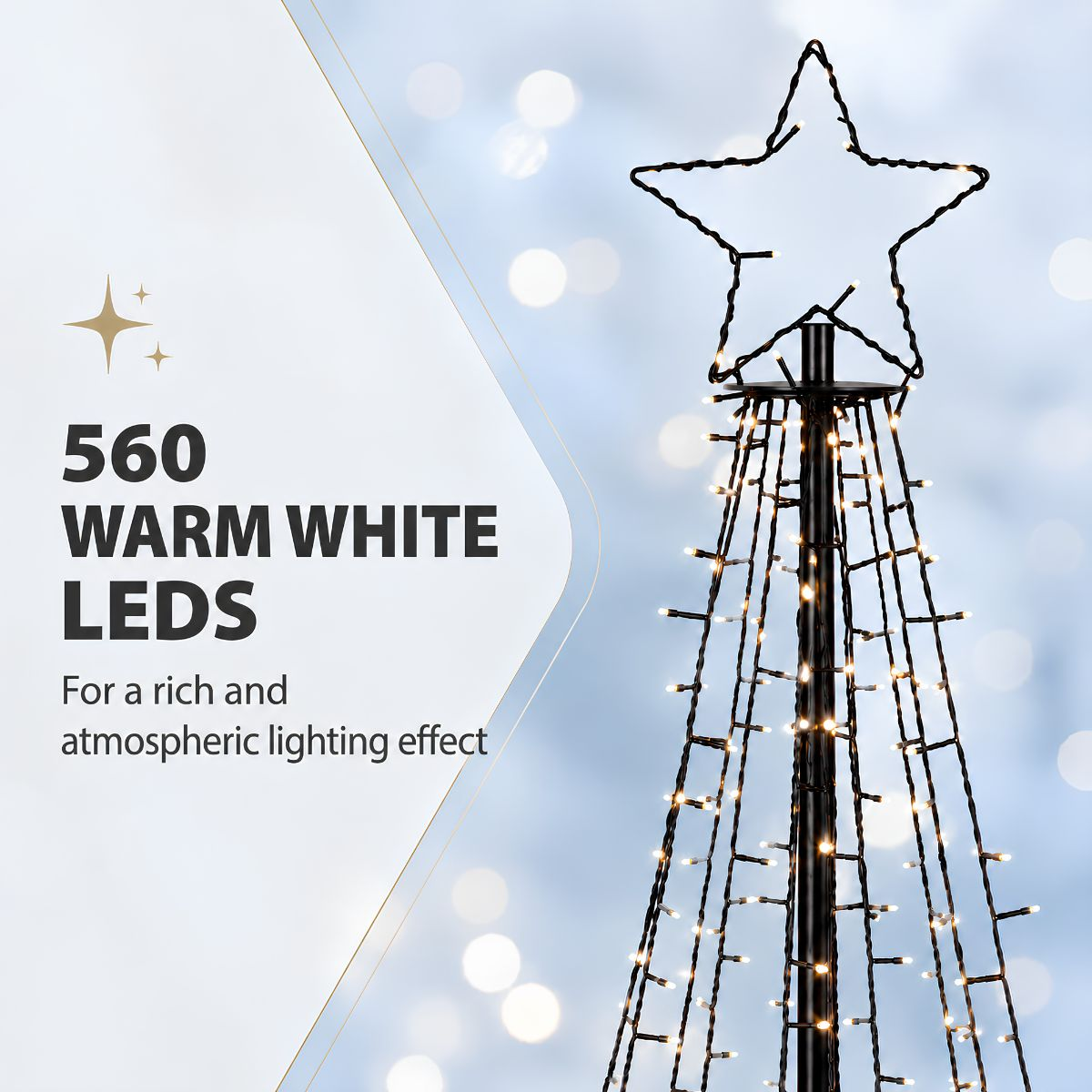 Eine schwarze Mastleuchte mit 560 warmweißen LEDs und Sternspitze vor verschwommenem blauem Hintergrund.