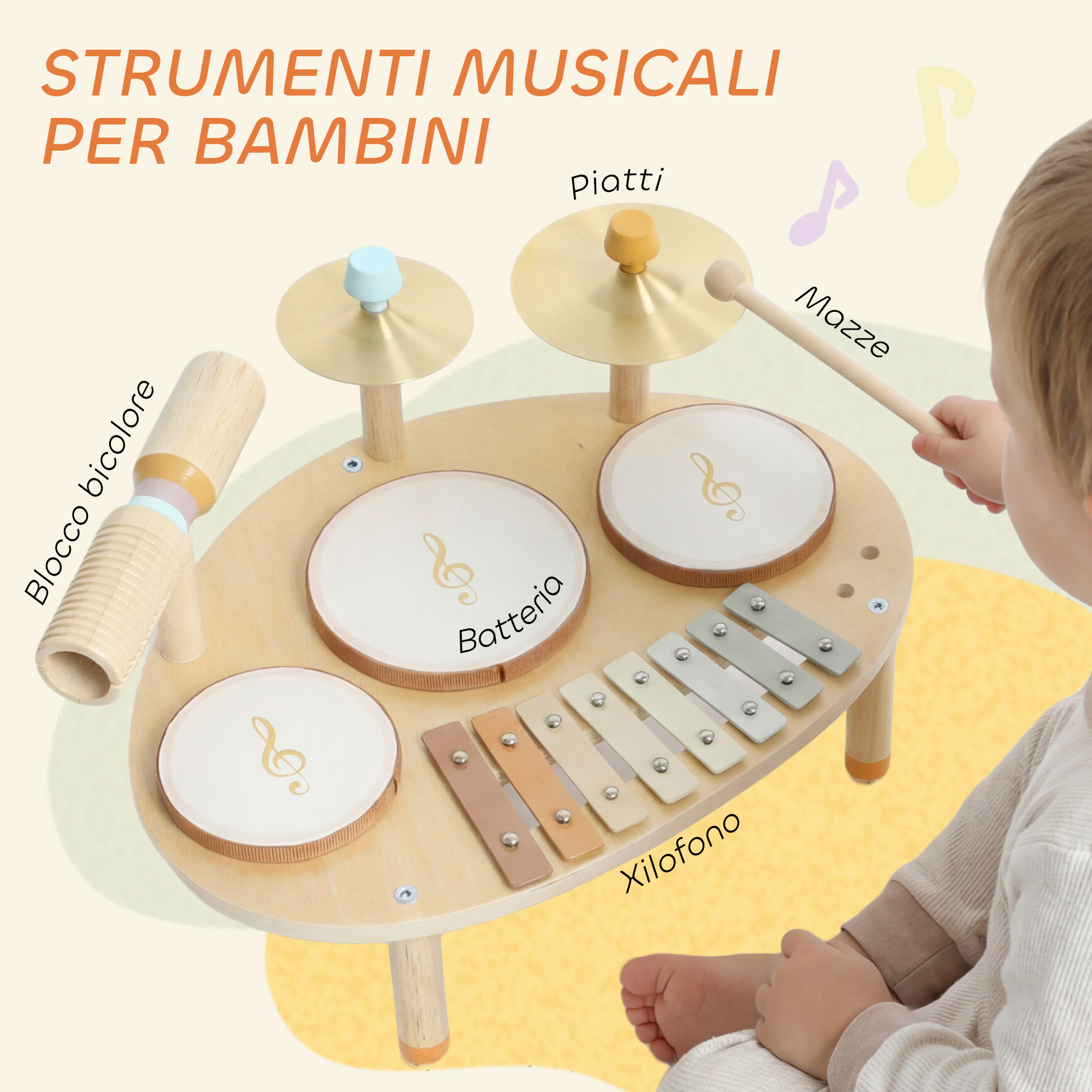 Bambino piccolo che gioca con un set di strumenti musicali in legno tra cui tamburi, piatti e xilofono.