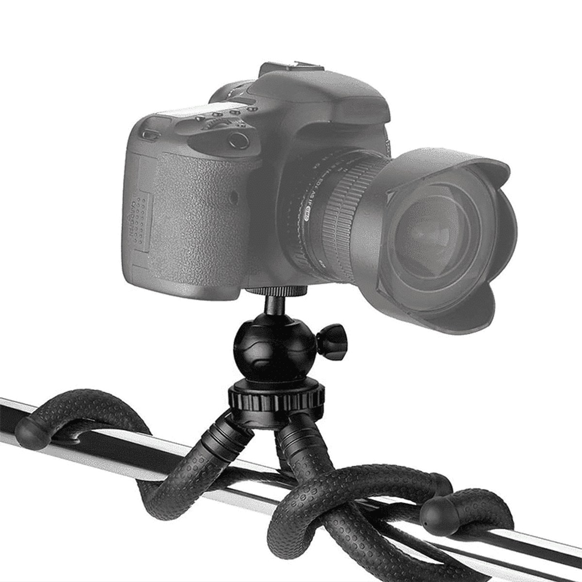 A black DSLR camera mounted on a flexible mini tripod wrapped around a bar against a white background.