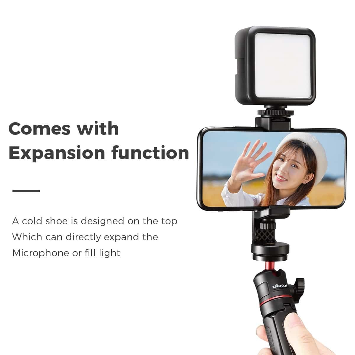 Smartphone auf Stativ mit LED-Licht und Text "Comes with Expansion function".