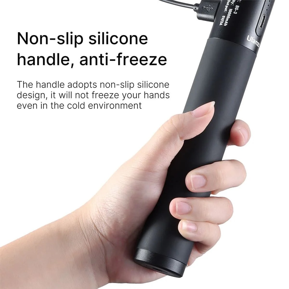 Hand holds a black, non-slip silicone handle with text