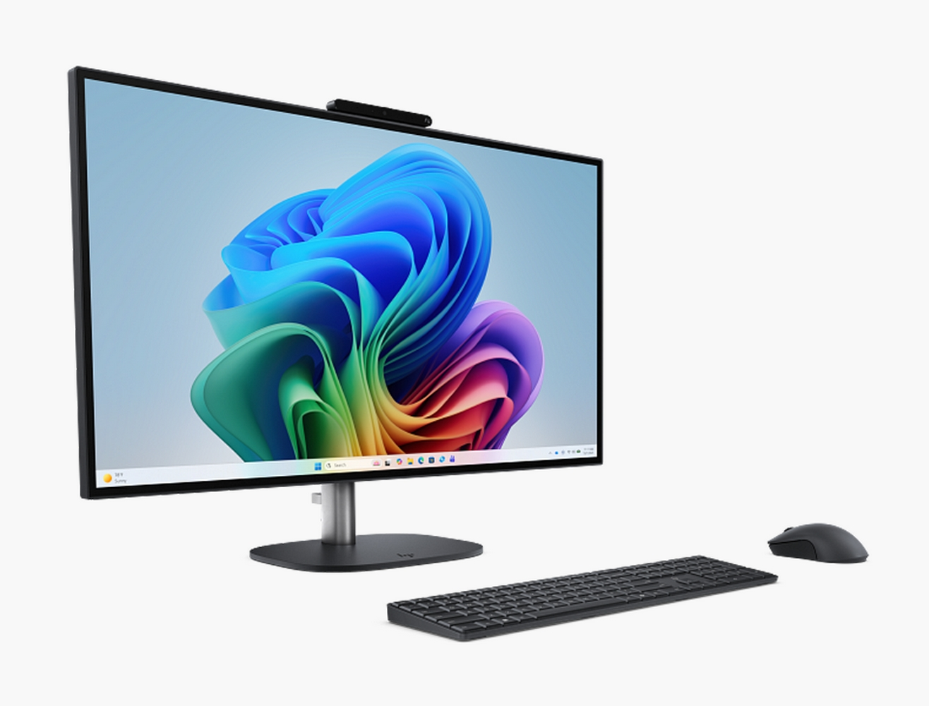 Un moderno computer all-in-one con sfondo colorato, tastiera nera e mouse su sfondo bianco.