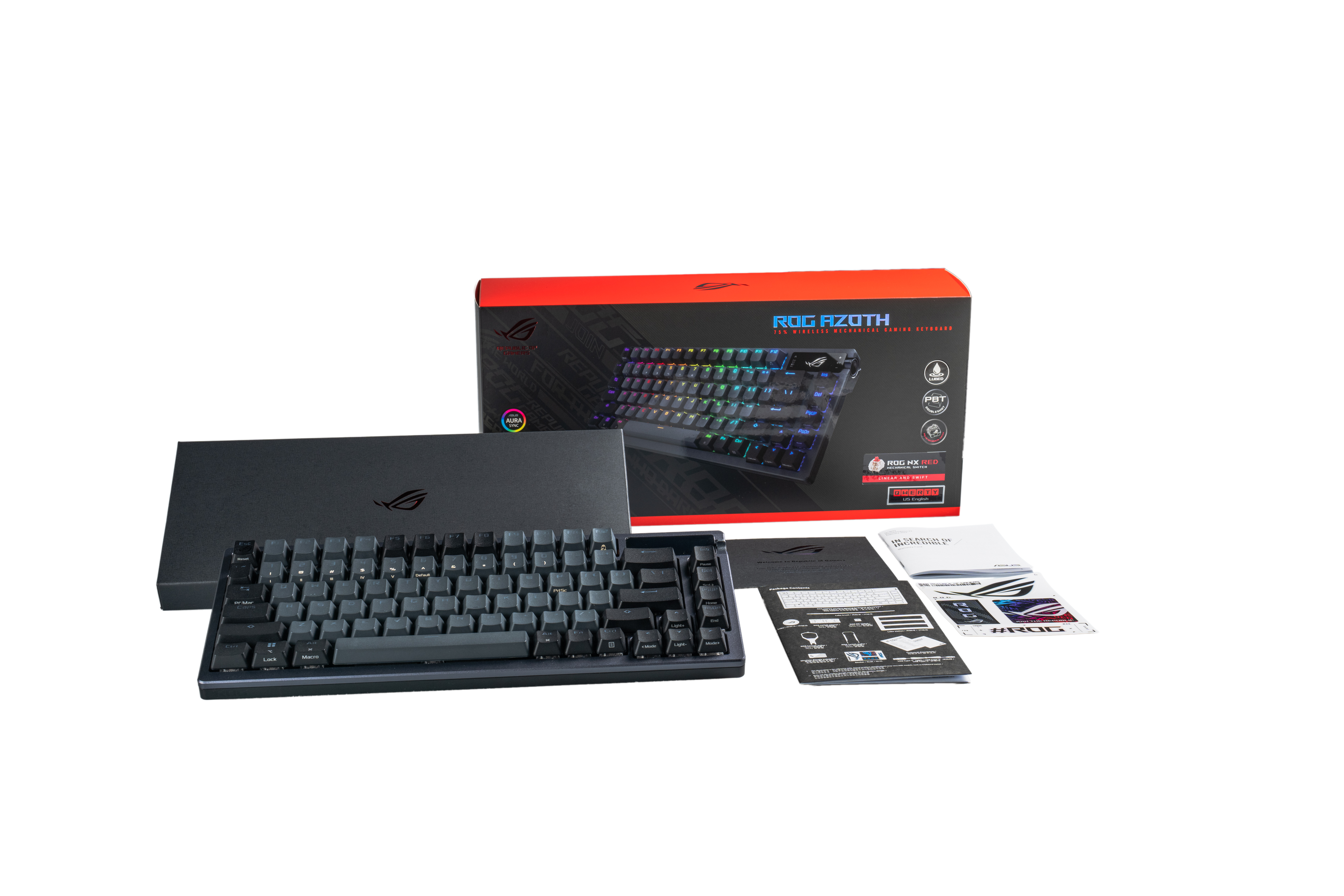 Teclado para juegos ROG Azoth negro con su caja, accesorios y manuales sobre fondo negro.