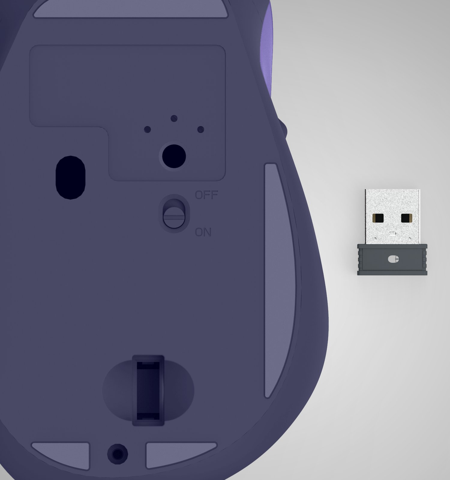 Unterseite einer violetten kabellosen Computermaus mit einem Ein-Aus-Schalter und einem separaten USB-Empfänger daneben.