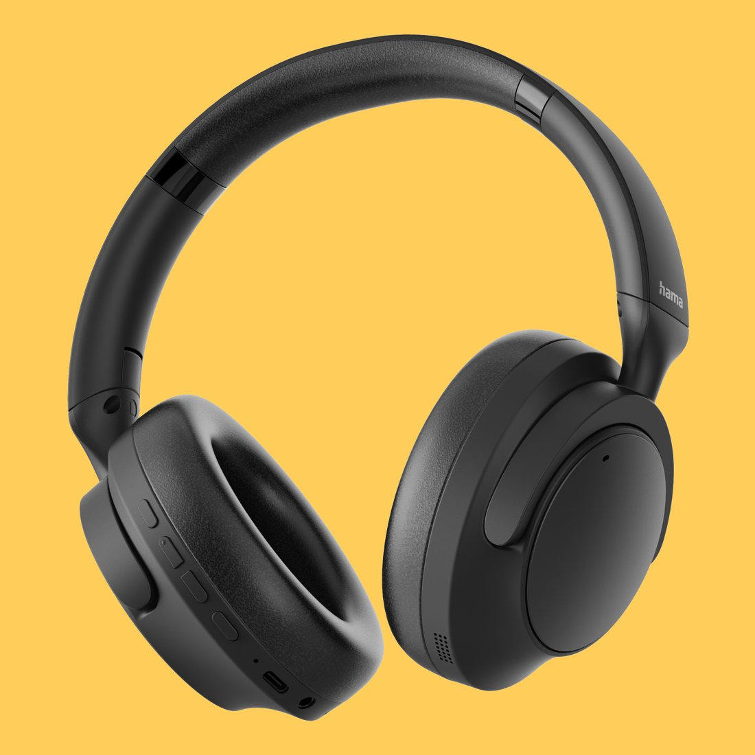 Schwarze Over-Ear-Kopfhörer mit gepolsterten Ohrmuscheln und integrierten Tasten vor gelbem Hintergrund.