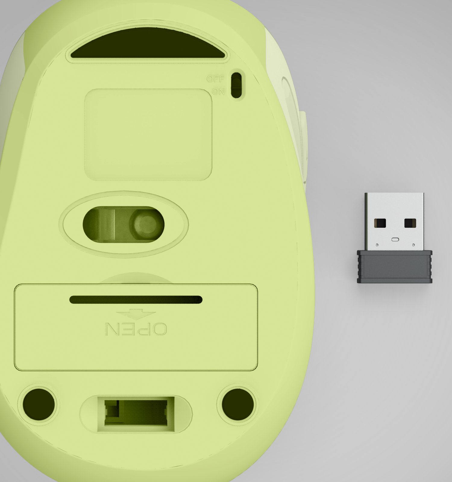 Lato inferiore di un mouse per computer wireless verde chiaro con un ricevitore USB accanto.