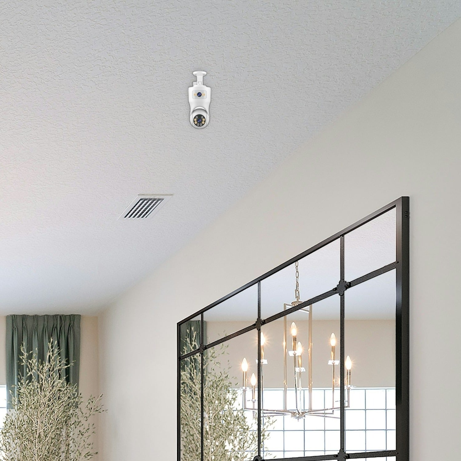 Una cámara de seguridad blanca está montada en el techo blanco de una habitación con un gran espejo negro.