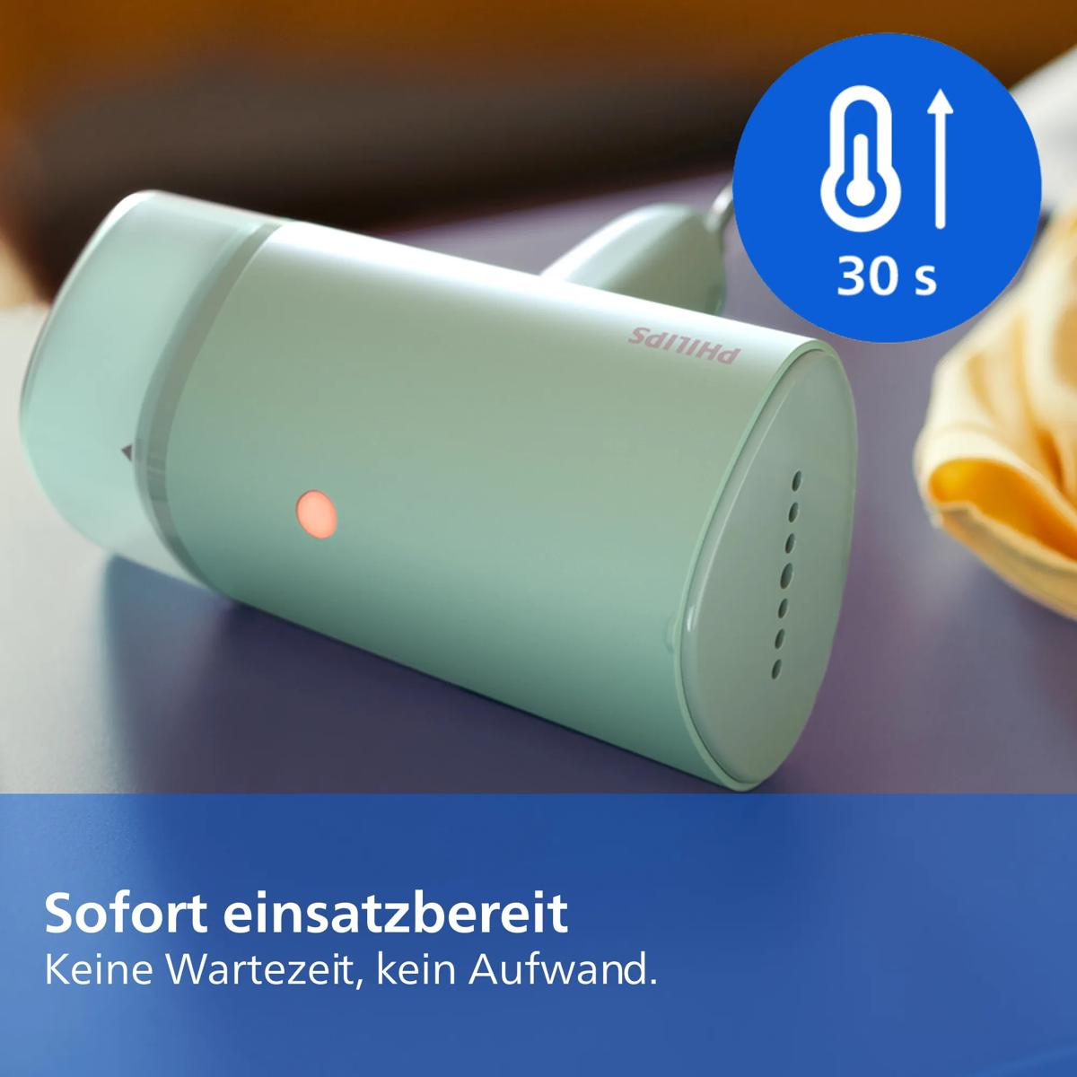 Ein mintgrüner Handdampfgarer liegt auf einer blauen Oberfläche, daneben ein Thermostat-Symbol mit Aufschrift 30s.