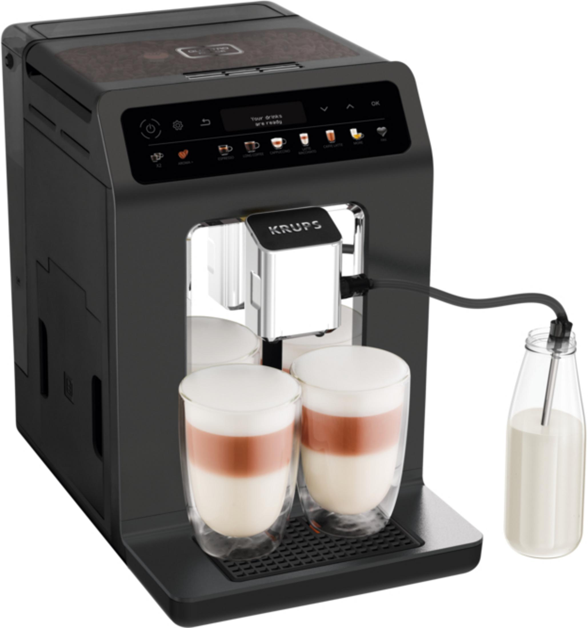 Schwarze Krups Kaffeevollautomat mit zwei gefüllten Gläsern und einer Milchflasche.