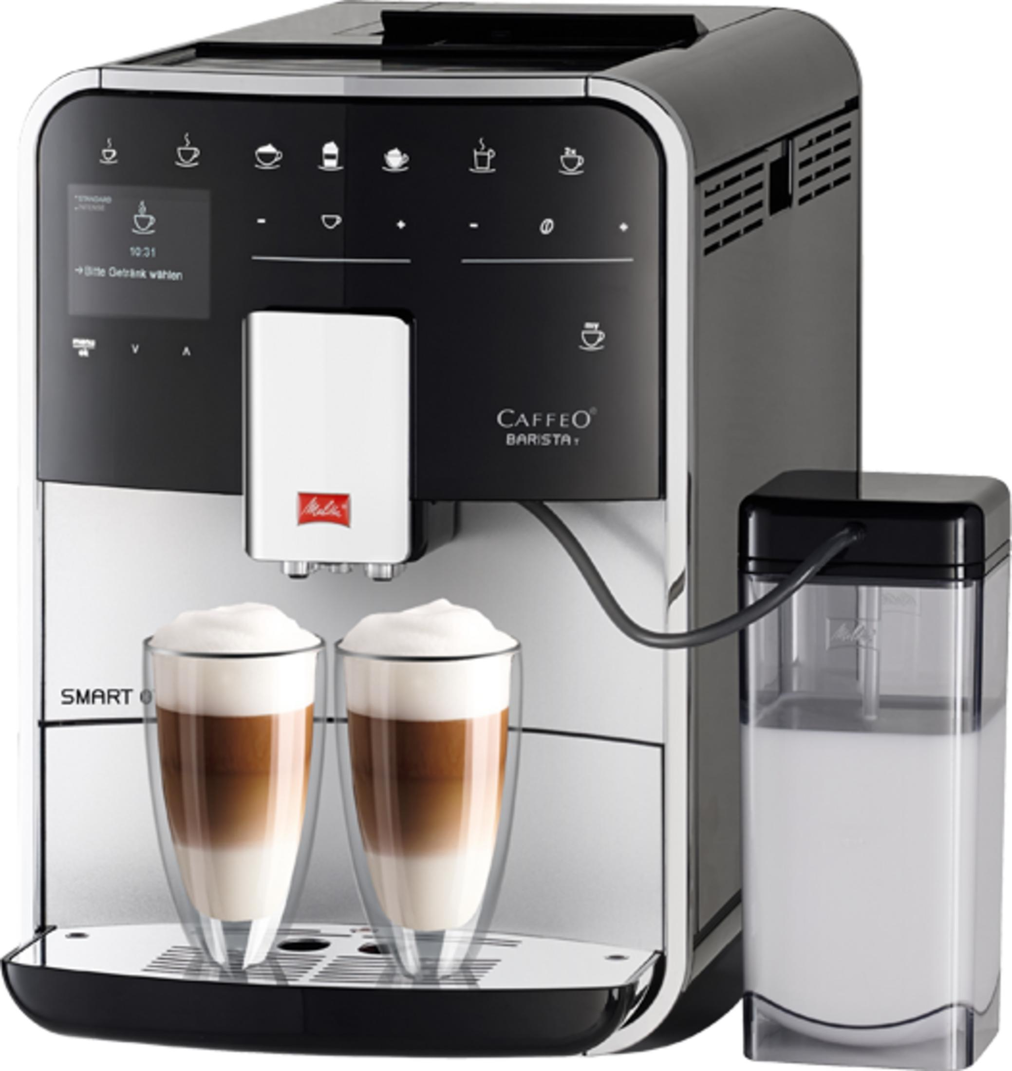 Modern coffee machine with two layered coffee drinks in glasses and an external milk container on a silver surface.
