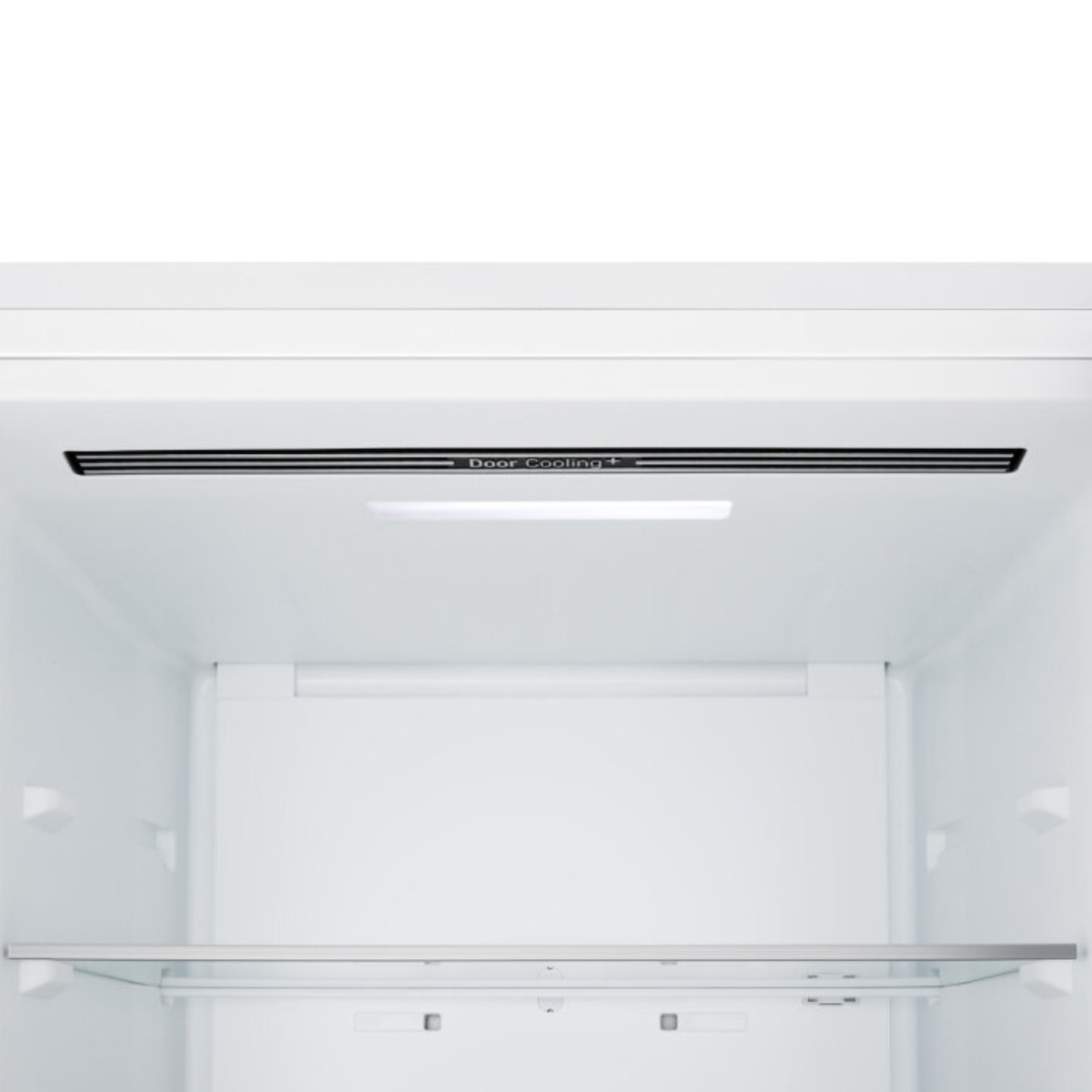 Das Innere eines weißen Kühlschranks mit LED-Beleuchtung und Glasboden.
