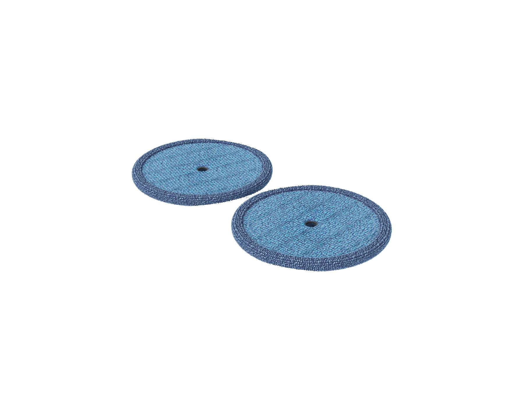 Dos almohadillas circulares planas azules con bordes más oscuros y un agujero central sobre fondo blanco.