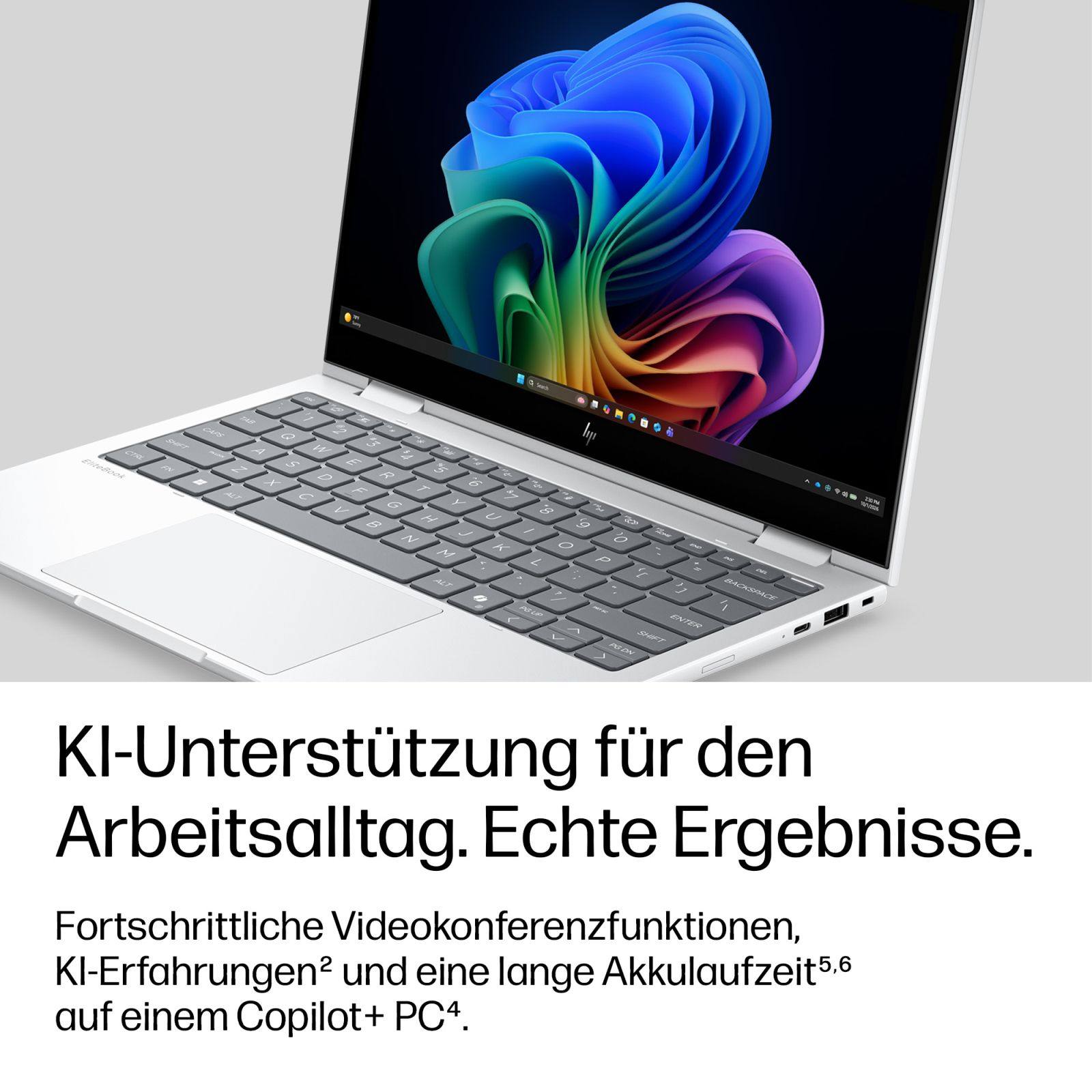 Ein weißer Laptop mit bunter abstrakter Bildschirmgrafik und deutschem Werbetext.