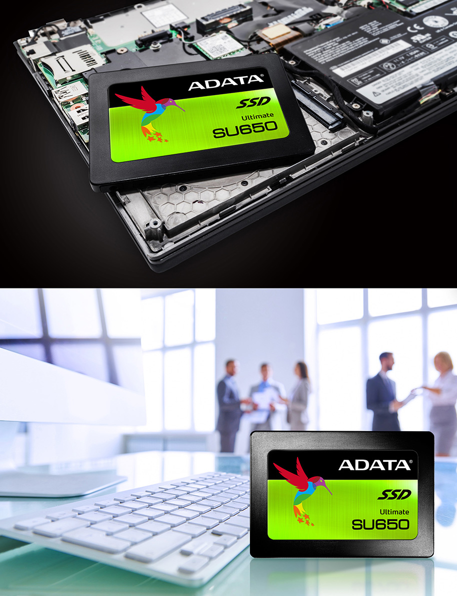 Ein ADATA SU650 SSD liegt auf einem Laptop-Motherboard und in einer modernen Büroumgebung auf einem Tisch.