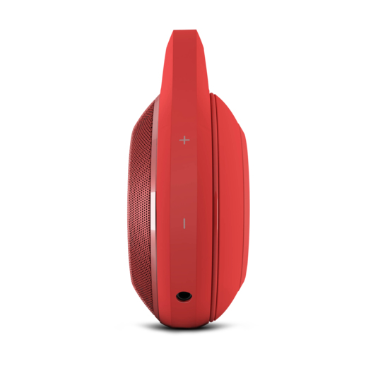 Roter kabelloser Lautsprecher in ovaler Form mit integriertem Griff und Lautstärketasten.
