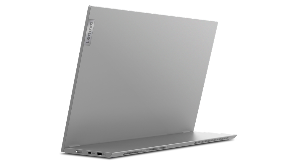 Un computer portatile Lenovo argentato su una superficie bianca con porte visibili.