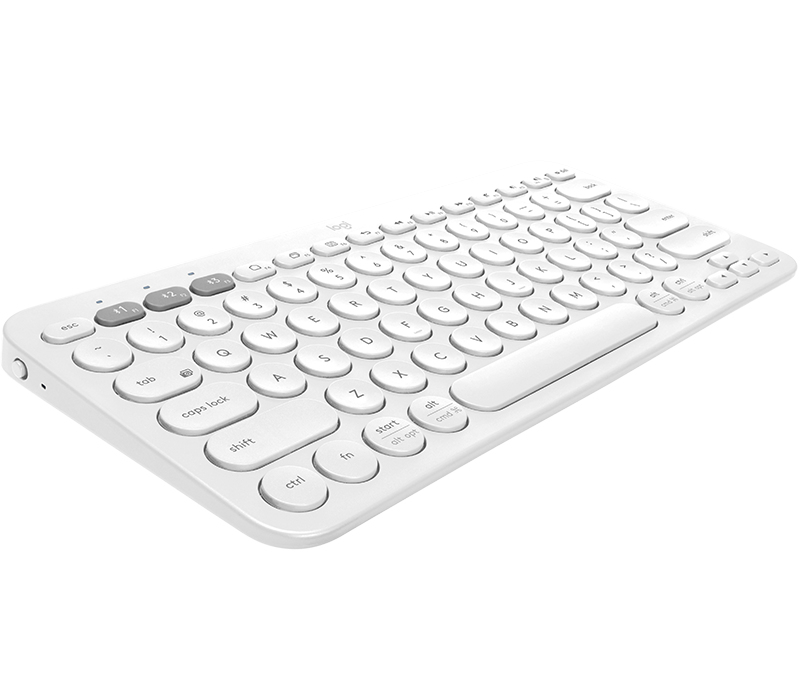 Eine weiße kabellose Kompakt-Tastatur mit runden Tasten in einer weißen Umgebung.