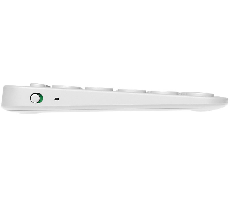 Seitenansicht einer weißen Tastatur mit einem runden Ein-Aus-Schalter und einer kleinen LED-Anzeige.