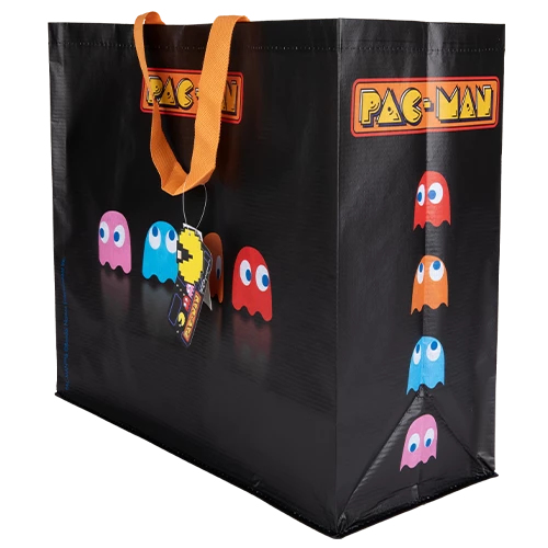 Eine schwarze Pac-Man-Einkaufstasche mit orangen Henkeln und bunten Geister-Grafiken.