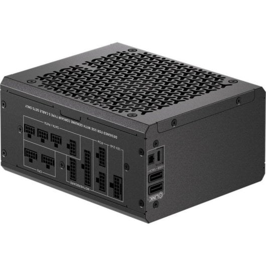 Schwarzes PC-Netzteil mit modularer Kabelanschlussseite und gemustertem Lüftungsgitter oben.