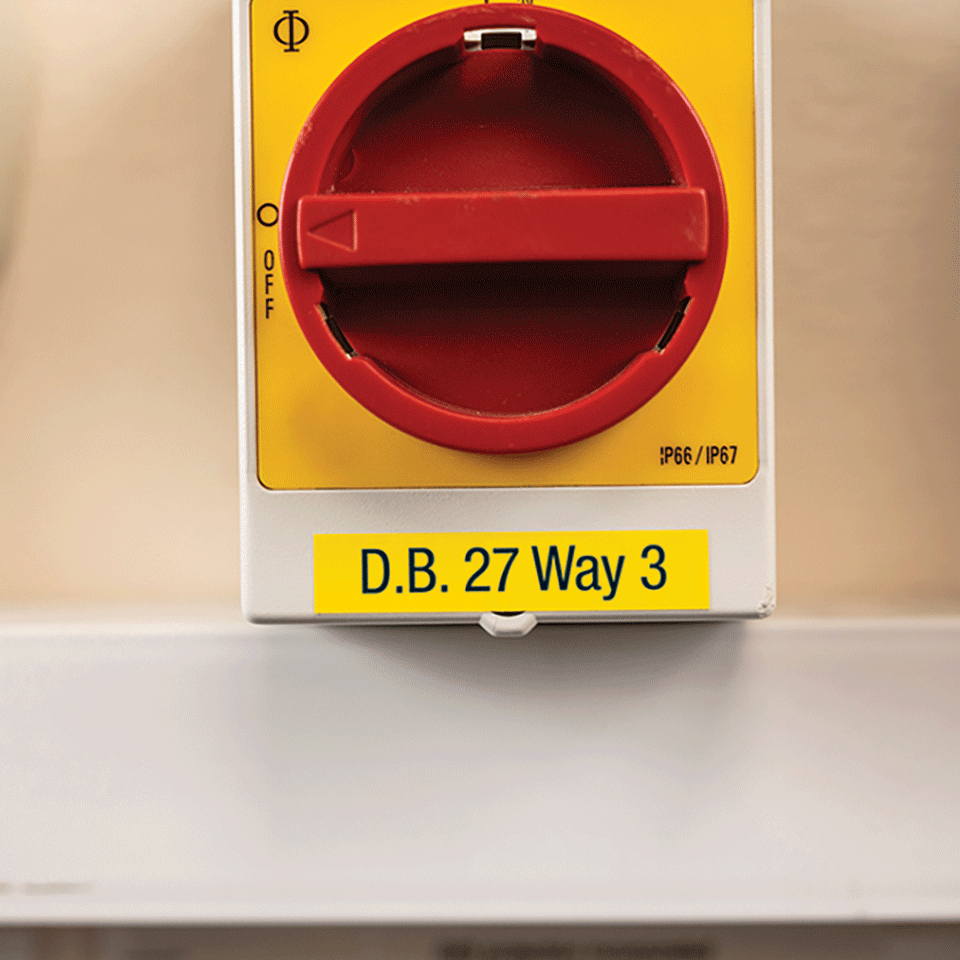A red rotary switch on a yellow plate labeled D.B. 27 Way 3 inside a white box.