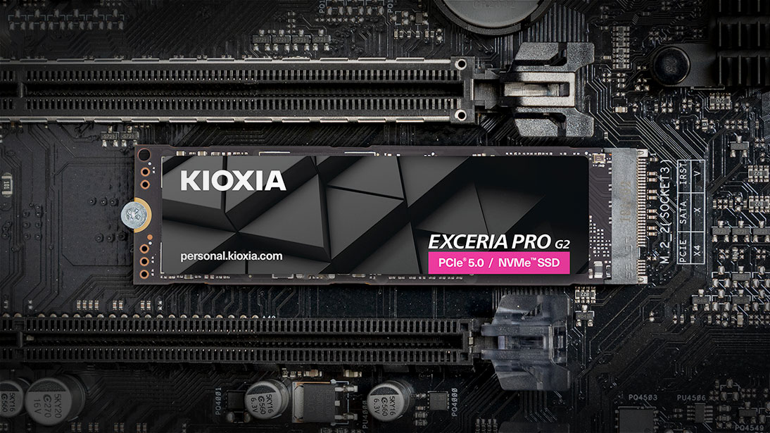 A Kioxia Exceria Pro G2 PCIe 5.0 NVMe SSD rests on a black computer motherboard.