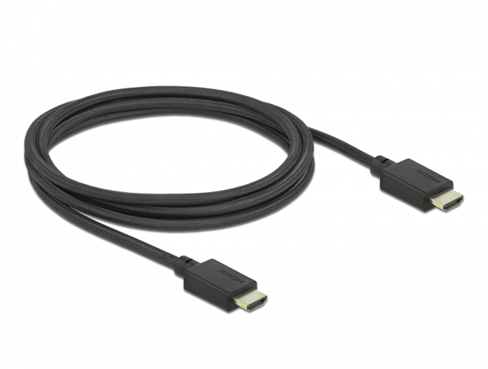 Ein gewickeltes, schwarzes HDMI-Kabel mit goldenen Anschlüssen auf einer weißen Fläche.