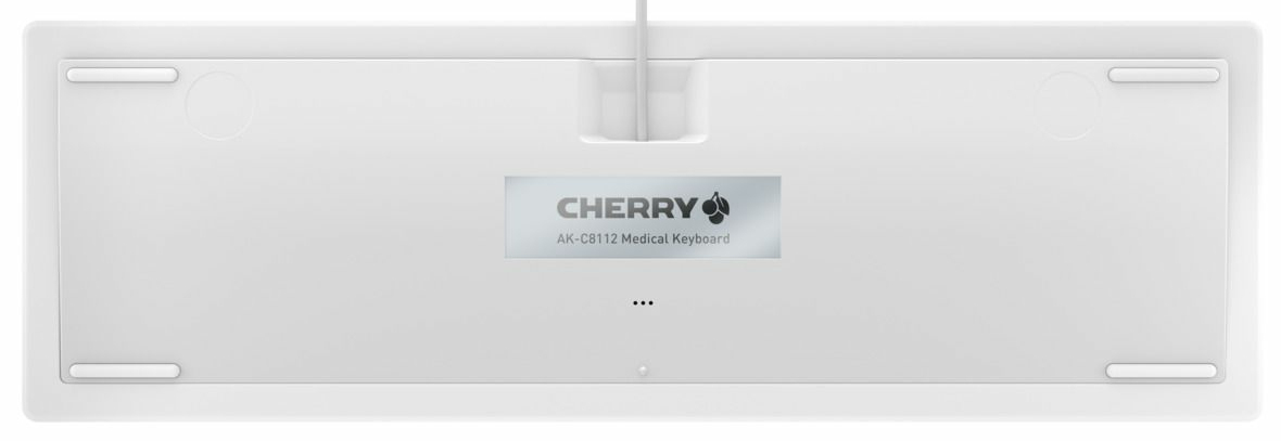 Unterseite einer weißen CHERRY AK-C8112 Medical Tastatur mit Etikett und Kabelausgang oben.