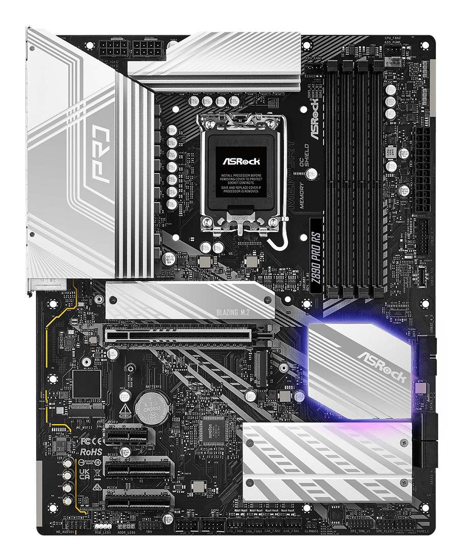Szczegółowy widok czarnej płyty głównej AsRock ze srebrnymi radiatorami i różnymi komponentami obwodu.