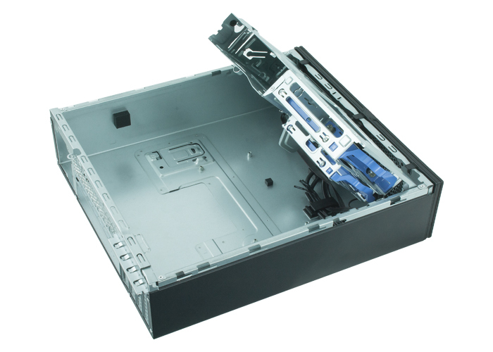 An empty desktop computer case with its internal metal chassis and drive bays visible.