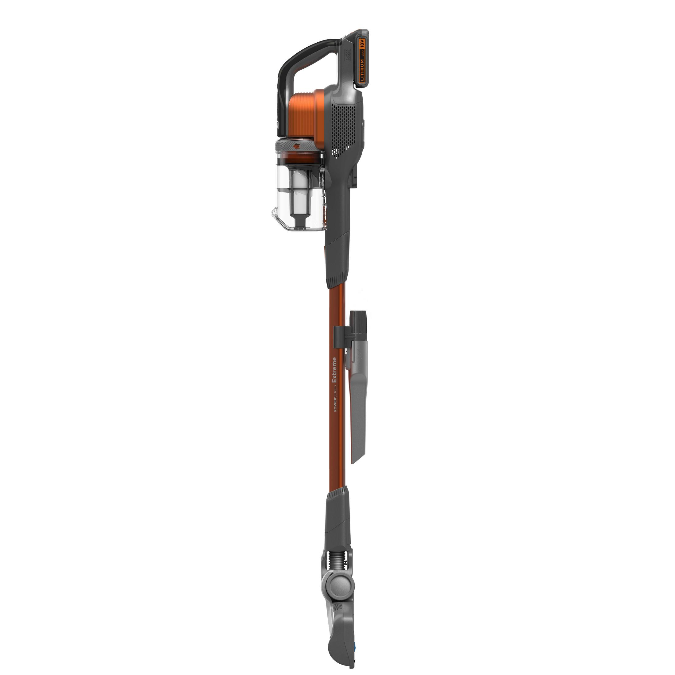 A vertical orange and grey cordless stick vacuum cleaner with a transparent dust canister against a white background.