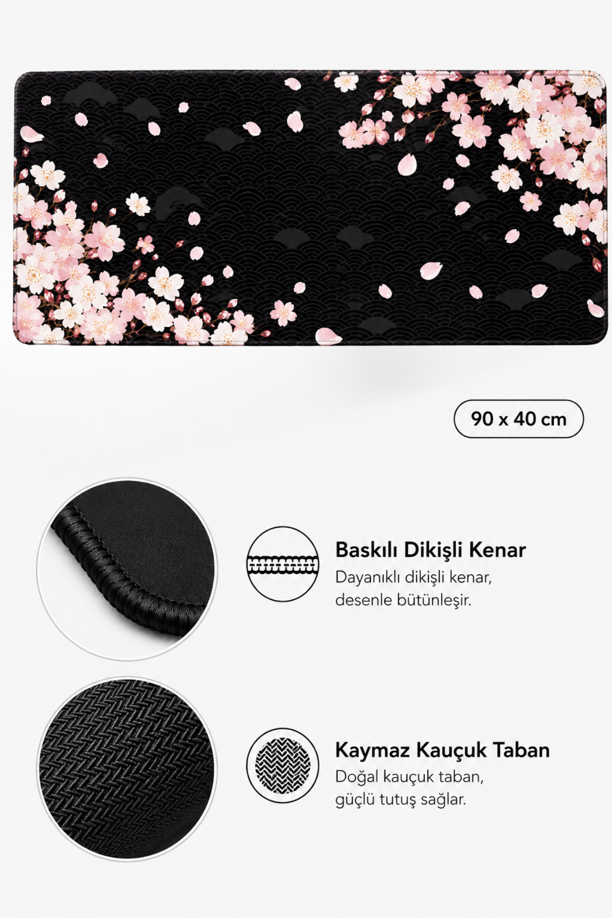 Siyah dalga desenli arka plan üzerinde pembe kiraz çiçekleri, dikili kenarlar ve kauçuk taban içeren büyük bir masa örtüsü.