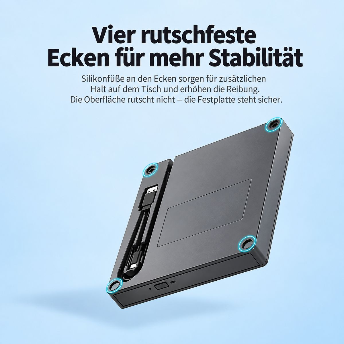 Unterseite eines schwarzen Geräts mit vier Silikonfüßen an den Ecken und integriertem USB-Kabel.