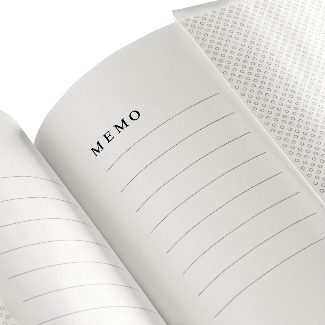 Ein offenes Notizbuch mit der Aufschrift MEMO und linierten Seiten.