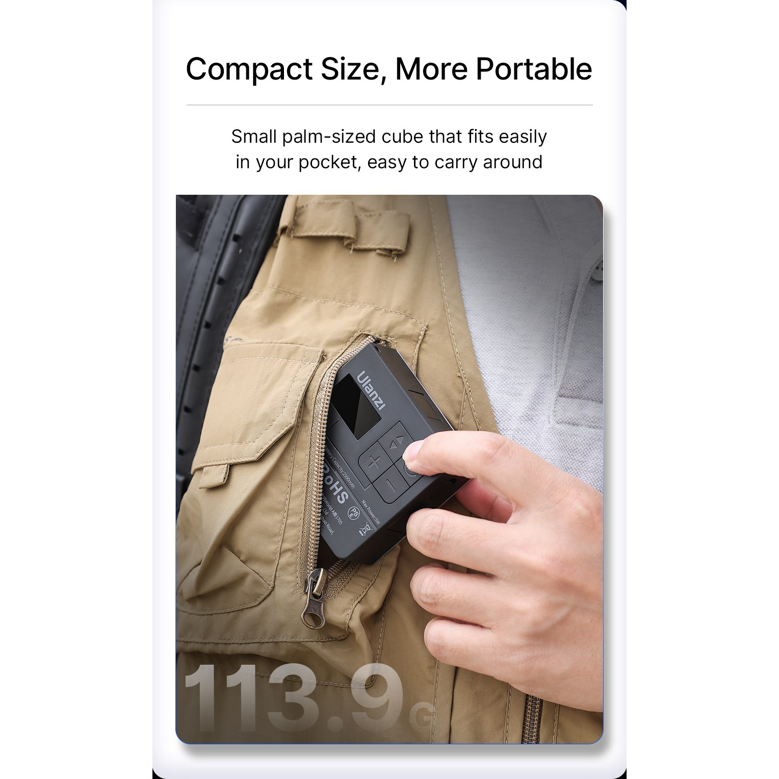 A hand pulls a small black Ulanzi box out of a chest pocket on a beige vest.